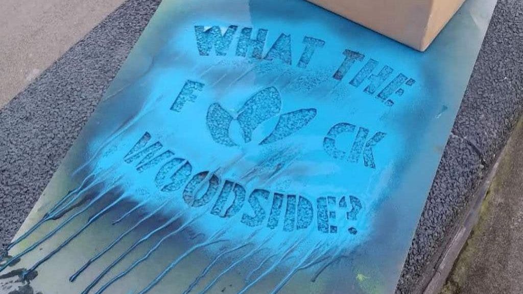 Five WA homes raided and six Rebels arrested for anti-Woodside spray chalk